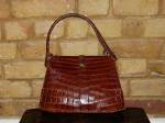 Brown crocodile skin bag with handles
