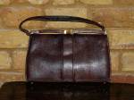 Dark brown snakeskin bag with handle