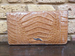Tan crocodile skin clutch bag