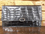 Black crocodile skin clutch bag