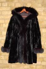 Black reversible sheared mink coat with fox trim hood