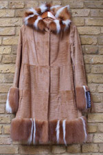 Cognac kid coat with raccoon cuffs and hood