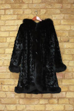 Black reversible mink coat with fox trim and hood