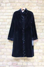 Black sheared mink coat with button trim